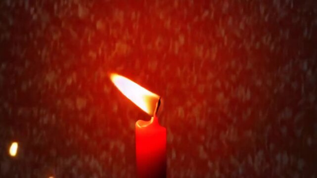 Red candle light for Christmas celebration, Xmas background. Wax candlelight.