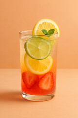 a layer of fruit infused with carbonated water in a glass cup