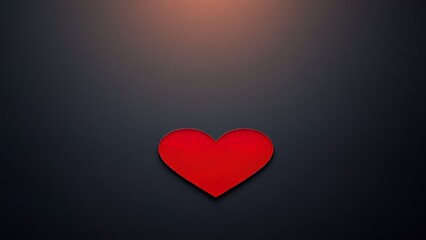 Red heart shape on a sleek black surface, radiating warmth and emotion with a minimalist aesthetic.