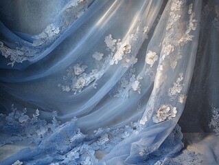 Elegant blue tulle fabric adorned with delicate white floral embroidery