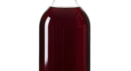 Dark red liquid filling a clear glass bottle, against a black background
