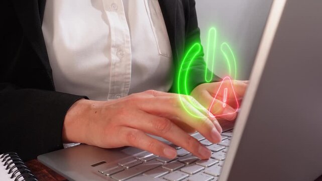 Warning at system startup. Visual detail of an executive using her laptop in the office, with a virtual icon of a power icon with a warning sign.