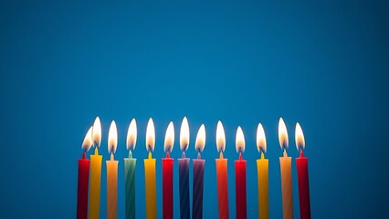 Vibrant candles glowing against a blue backdrop, creating a festive and celebratory atmosphere.