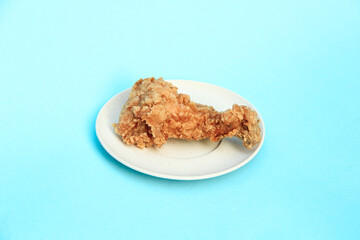 Fast Food Fried Chicken on a plate with a blue background