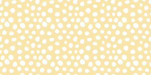Aesthetic pattern of white dots of different sizes on a soft orange background.  © Mr. Han Han