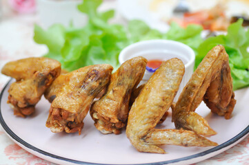 chicken wings or deep fried chicken , fried chicken and sauce
