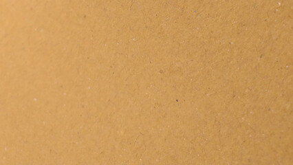 Background of brown kraft paper or cardboard texture. copy space background in beige yellow, brown.
