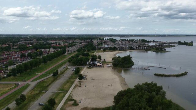 Drone view of the beach at Zeewolde, Flevoland, showing sandy shores and the surrounding town