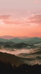 Obraz premium Misty mountain range at sunrise