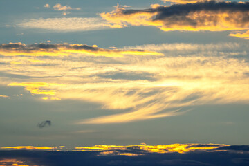Colorful sunset sky with clouds creating vibrant patterns over the horizon