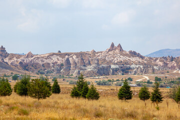 Majestic landscape of Cappadocia’s fairy chimneys, the region’s stunning geological wonders,...