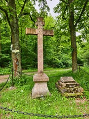 Cross at a pilgrimage site in the forest in the Czech Karst