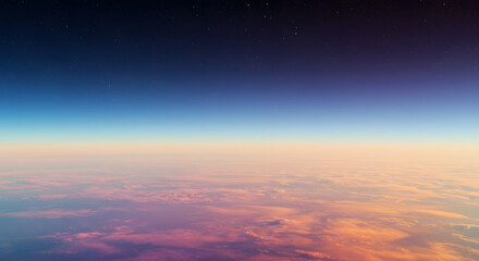 Serene aerial view of Earth's colorful atmosphere at sunset, with a glowing horizon over a sea of pink clouds and the darkness of space above