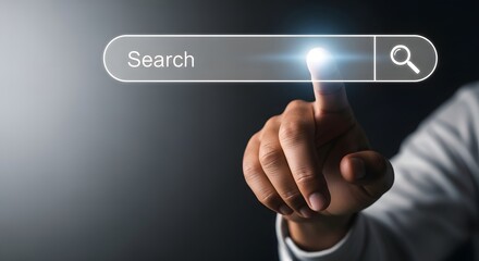 Obraz premium A hand touching a glowing search bar with a magnifying glass icon on a dark gray background