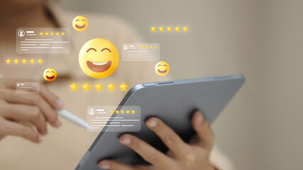Customer review feedback with smiley emoji and star rating on digital tablet