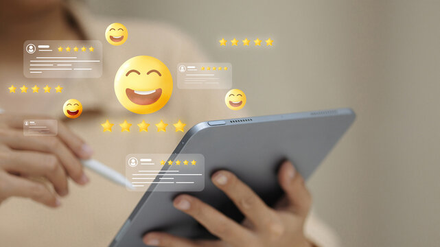 Customer review feedback with smiley emoji and star rating on digital tablet