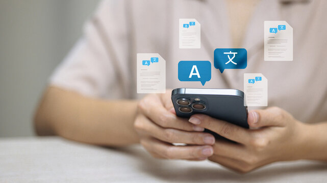 Mobile translation app with language icons on smartphone screen