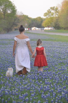 mother and daughter walking in park
