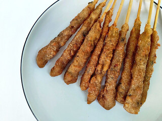 A Plate of Freshly Fried Chicken Sempol Skewers