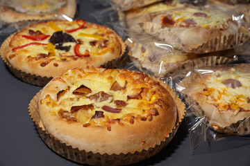 Delicious Mini Pizzas with Various Toppings and Cheese