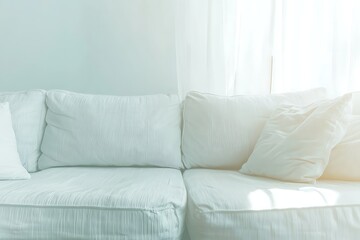 Bright and Cozy Living Room with White Couch and Soft Natural Light from Window