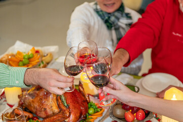 Family celebration Christmastime party enjoy happy to eat turkey dinner together with food and...