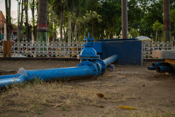 industrial blue piping junction. use for deliver water from the water pump in the city park