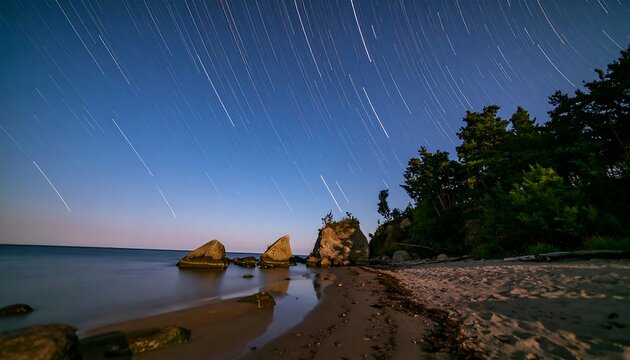 Star trails over the beach at night