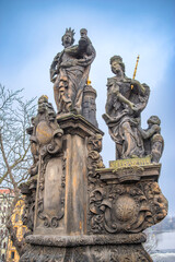 statues on the Charles Bridge, evening Prague. Czech Republic