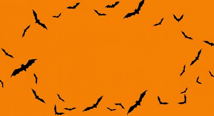 Silhouette of bats flying in a circular pattern against an orange background creating a halloween theme