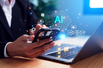 Businessman using smartphone and laptop with artificial intelligence technology icons, representing digital transformation, data innovation, and AI-driven business solutions.