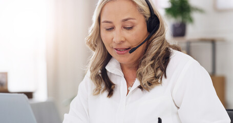 Psychologist, woman and video call with laptop in office for online support, advice and assessment. Psychology, mature person and headset with virtual consultation for therapy and progress follow up