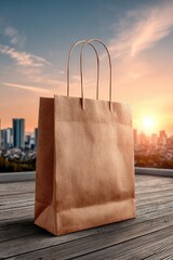 Brown paper shopping bag on rooftop at sunset
