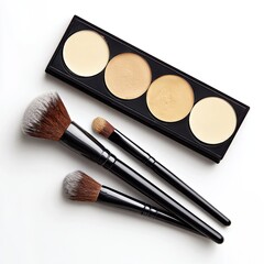 Makeup palette and brushes on white background