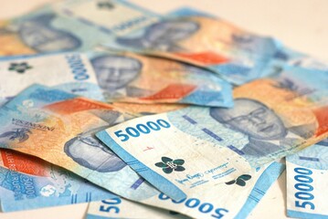 Economy and finance background with a selective focus on  Indonesian rupiah banknotes