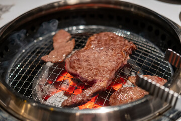 Sirloin Hanwoo Beef, marbled Korean Style Meat on the Grill. BBQ rare meat with soft focus