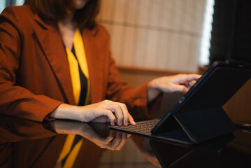 businesswoman using a stylus with digital tablet in office. Concept of smart technology, remote work