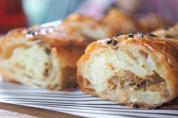 Savory turkish borek filled with meat and herbs on a plate