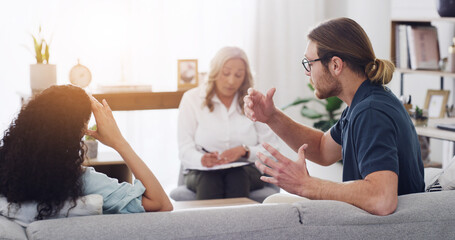 Couple, therapist and argument on sofa, fight and consultation for mental health at wellness...