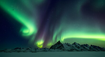 Aurora borealis over snow covered mountains