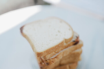 blurred White bread that is covered in flies makes the bread unhealthy