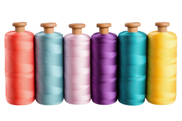 Vibrant collection of spools of thread displayed in a row with various colors creating a visually appealing arrangement for crafting enthusiasts