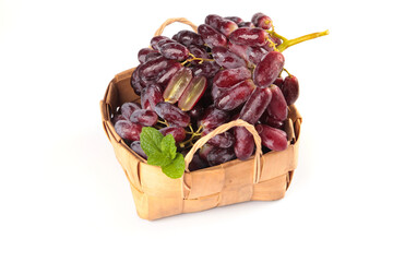 Fresh Red Grapes in Wicker Basket with Mint - Premium Quality Fruit on White Background