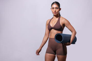Fit Girl Holding Yoga Mat Isolated On Gray Background