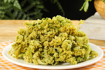 Dried Sichuan Cauliflower - Traditional Chinese Preserved Vegetable Dish on White Plate