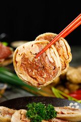 Mongolian Mutton Wrapped in Crepe with Chopsticks - Traditional Asian Cuisine