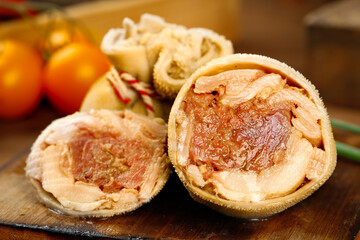 Traditional Mongolian Lamb Bao Steamed Buns with Pork Belly Filling on Wooden Board
