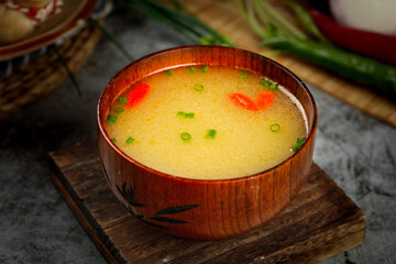 Traditional Mongolian Lamb Soup with Fresh Herbs in Wooden Bowl - Delicious Asian Cuisine