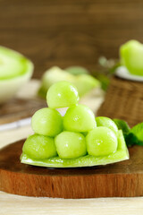 Fresh Jade Green Melon Balls from Shandong China - Sweet Honeydew Fruit Dessert on Wooden Board