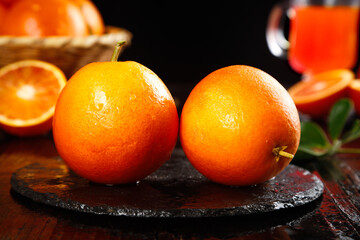 Fresh Tarocco Blood Oranges with Deep Rose Scent on Slate Board